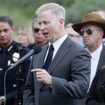 George Brauchler speaking outside to the public about a shooting trial